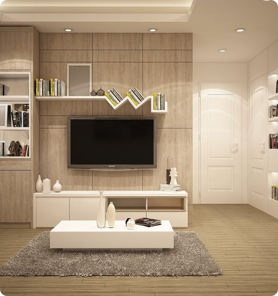 A living room with a tv and some books